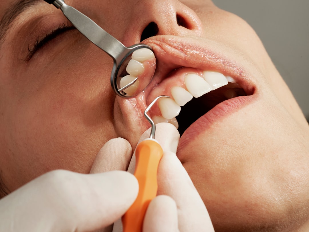 Dental exam with a mirror and dental tool