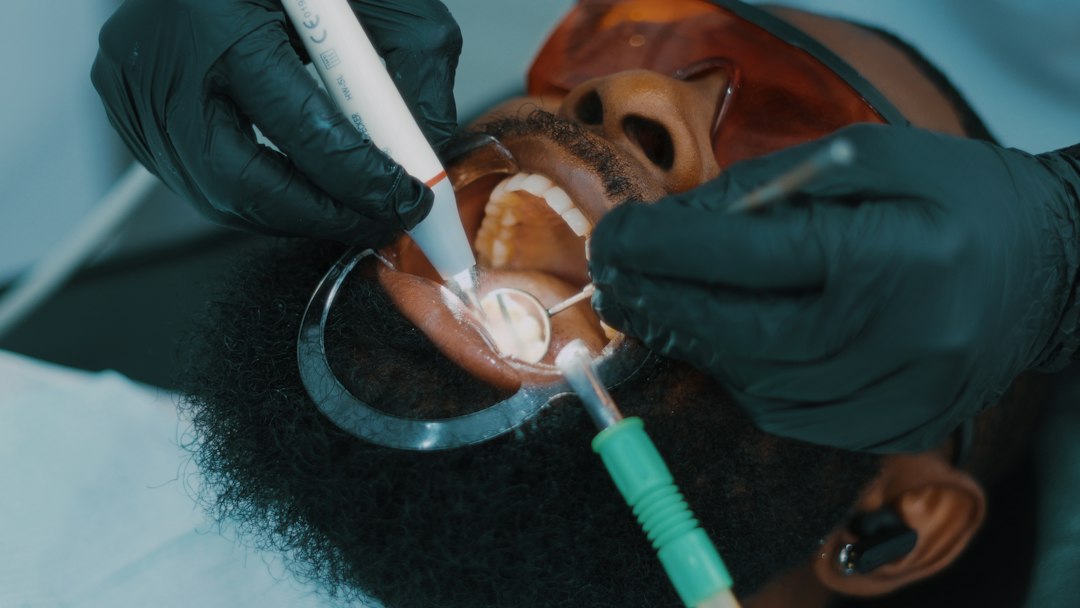 Patient receiving dental treatment from a dentist