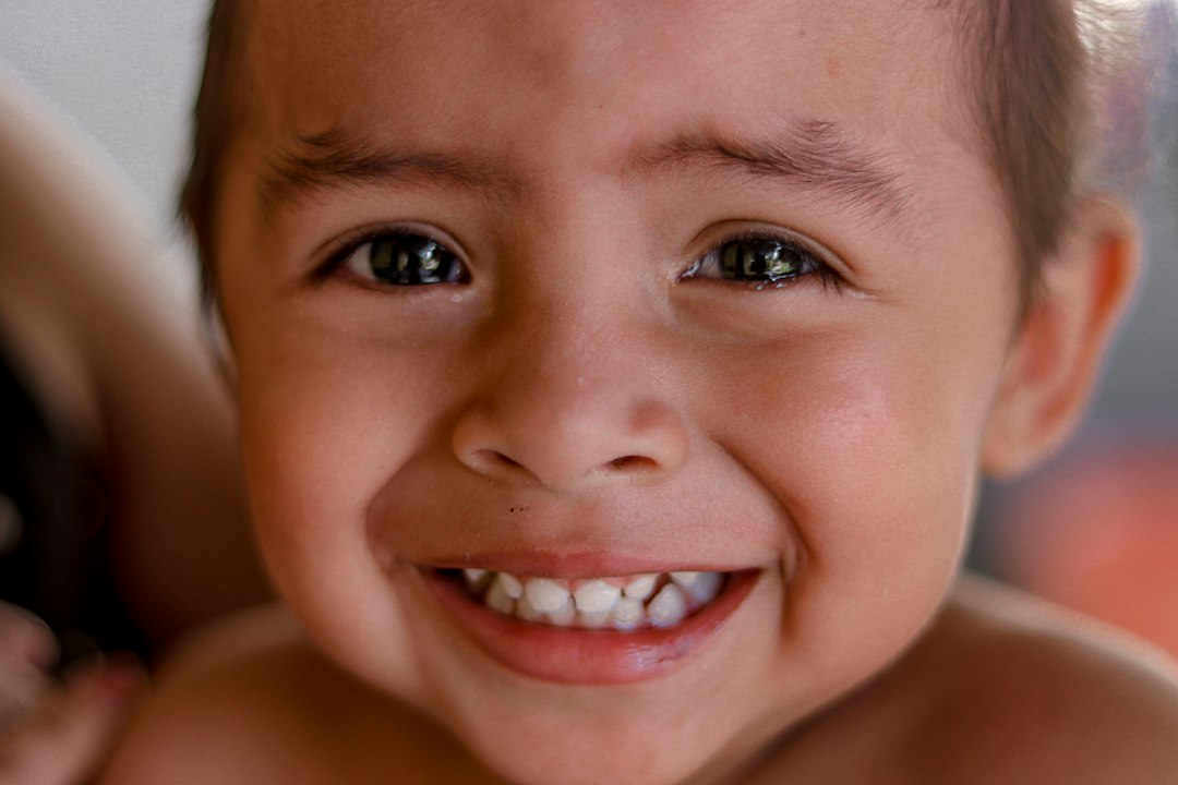 Smiling young boy with eyes closed