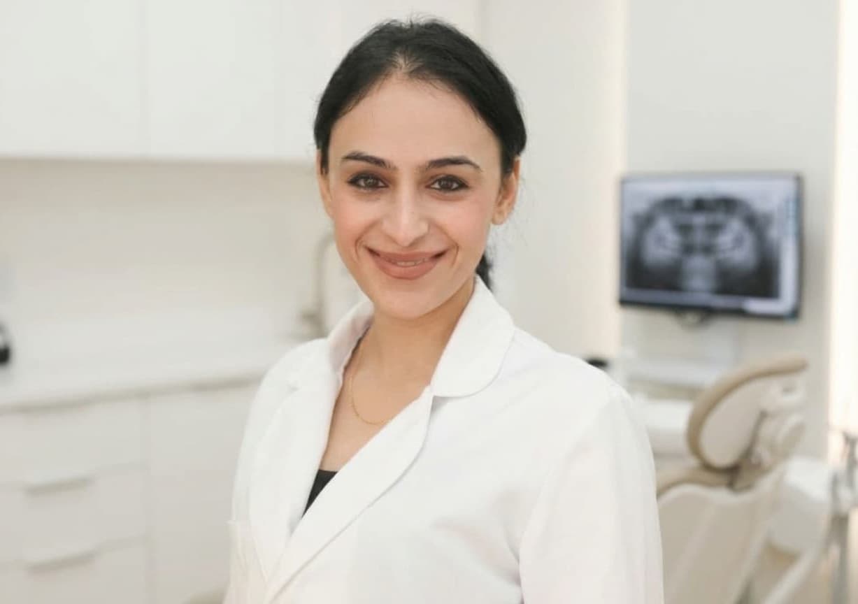Dr. Shaila Torbati, dentist and dental implant expert in South Gate, CA, in a modern dental office.